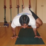 Kevin practices Parsva Bakasana