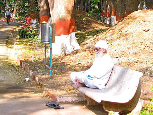 This man sits on this bench regularly and seems to disappear into it.